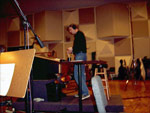 Sam takes a moment to look over the score and answer some questions before recording another take